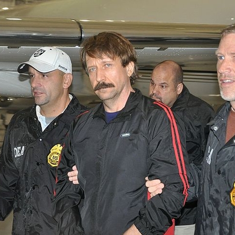 DEA agents escort international arms dealer Viktor Bout, who was extradited to the United States in 2010.