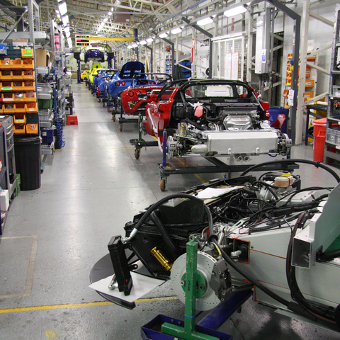An automobile factory: fears that the repetitive assembly line produced alienation in workers