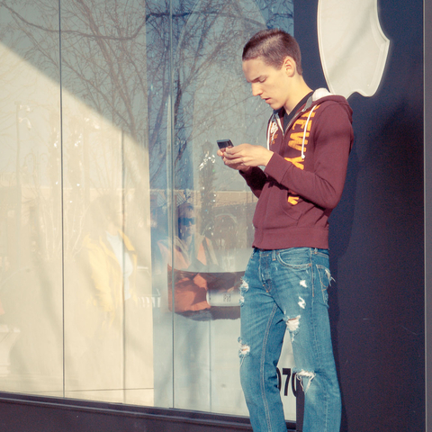 Texting outside an Apple Retail Store