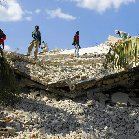 Haitians clear rubble days after the January 12, 2010 earthquake