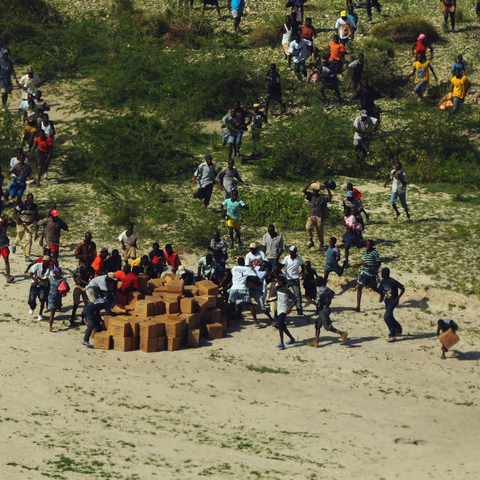 Haitians scramble for U.S. aid packages following the 2010 earthquake