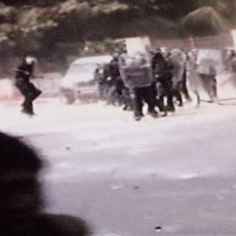 Security forces in riot gear confront protesters in the streets of Dakar on June 23, 2011.