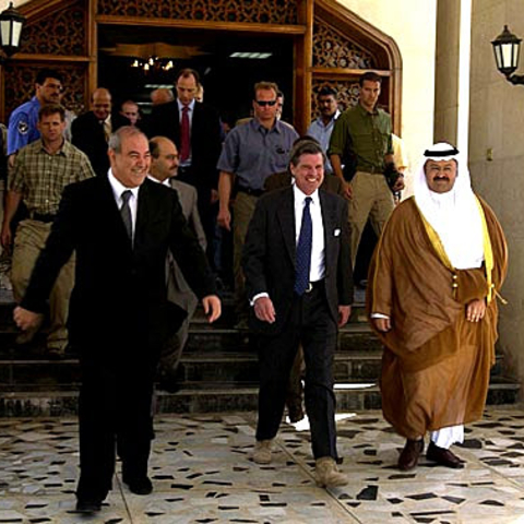 Iraqi Prime Minister Ayad Allawi (left), Ambassador L. Paul Bremer, and President Sheikh Ghazi Ajil al-Yawar