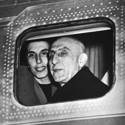 Iranian Prime Minister Mohammed Mossadegh and his daughter look out an airplane window following a 1951 trip to the United States