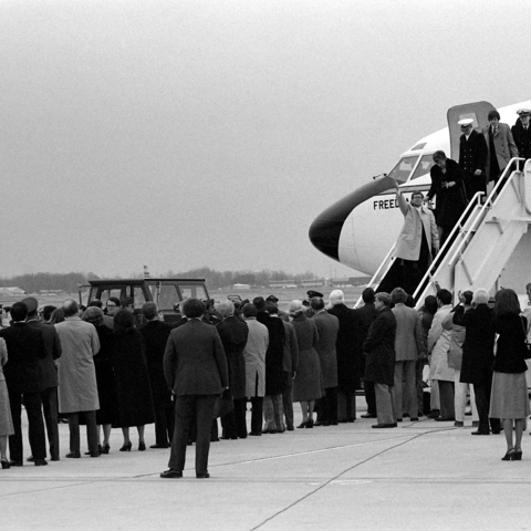 Americans held hostage in Iran return to the United States on January 27, 1981