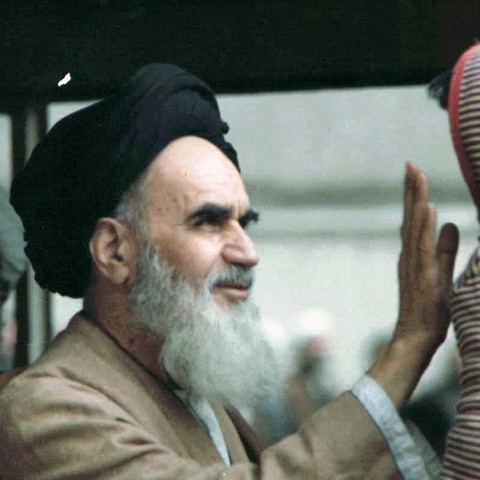 Ruhollah Khomeini with an Iranian child