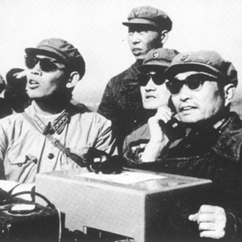General Zhang Aiping reporting the successful first detonation of a Chinese nuclear weapon to Premier Zhou Enlai.