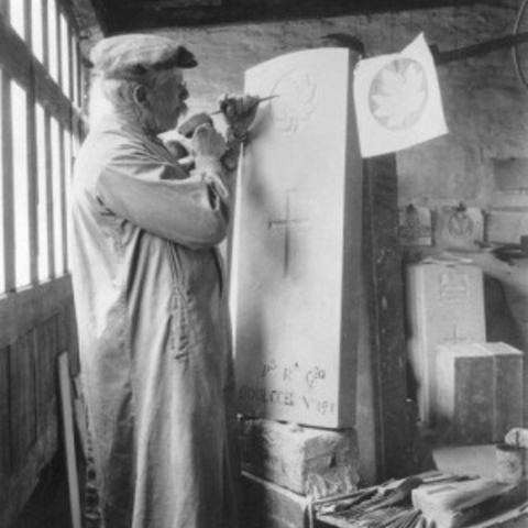 A worker for the Commonwealth War Graves Commission would spend a week carving a regimental badge onto a headstone.