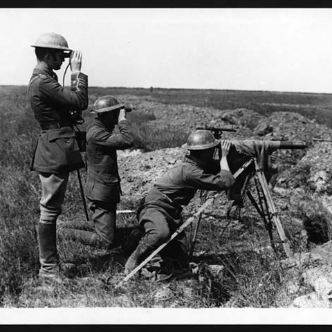 Three soldiers at an observation station on the Western Front in 1918.