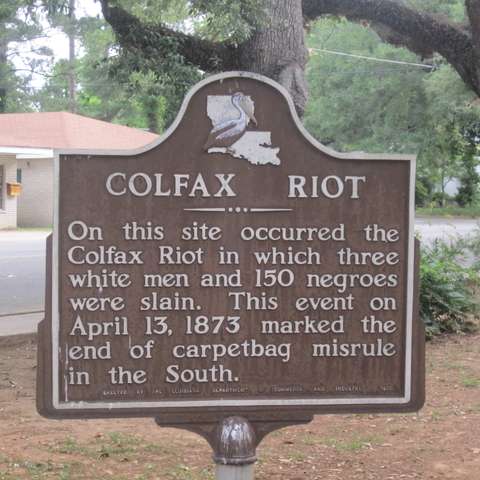 A historical marker put up in 1950 describing the Colfax Massacre as a riot.