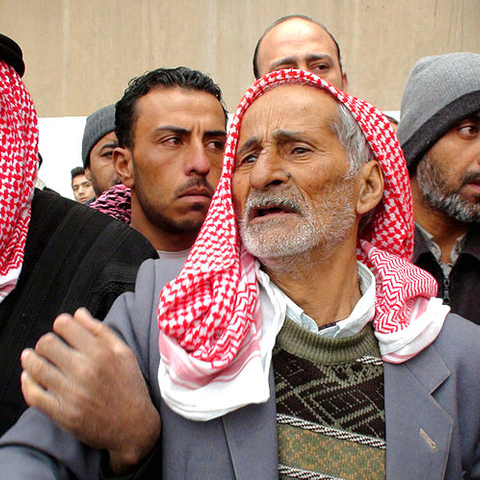 The father of a Syrian general killed in the civil war attends his son's funeral in Damascus in January 2012.