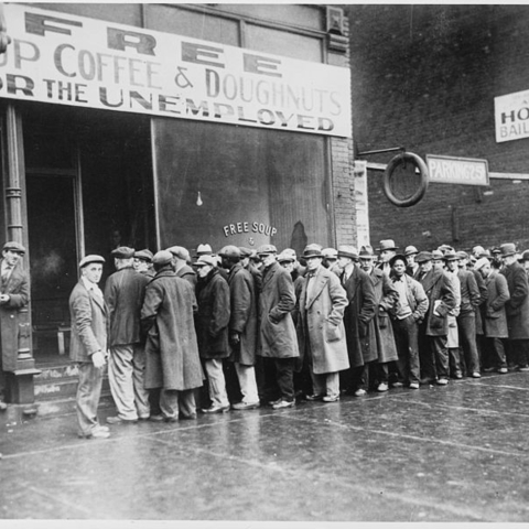 Unemployed men queued outside a depression soup kitchen opened in Chicago by Al Capone in February 1931.
