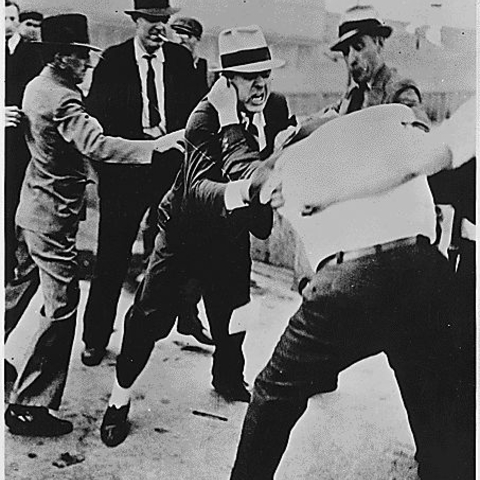 Men fight during a labor strike at the Ford Motor Company in May 1937.