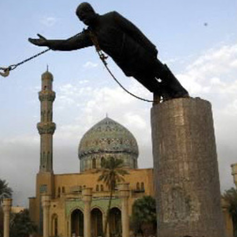 The statue of Saddam Hussein topples in Baghdad's Firdos Square on April 9, 2003.