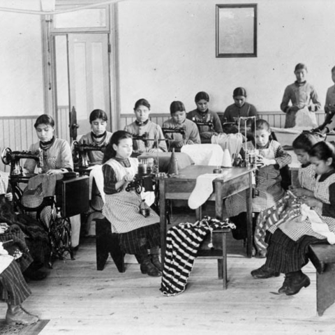 Female students sewing at an Indian Residential School.