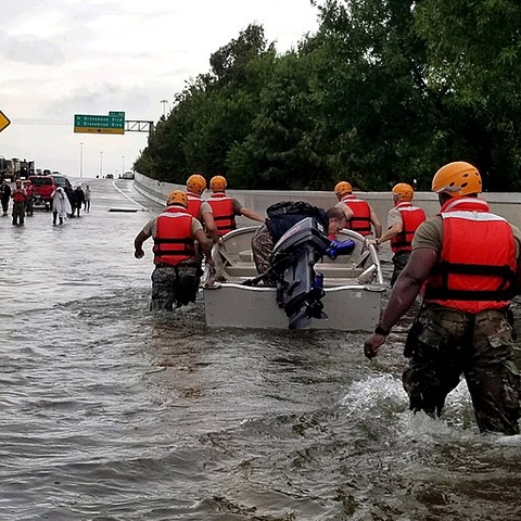 Soldiers with the Texas Army National Guard move through flooded Houston roads during Hurricane Harvey.