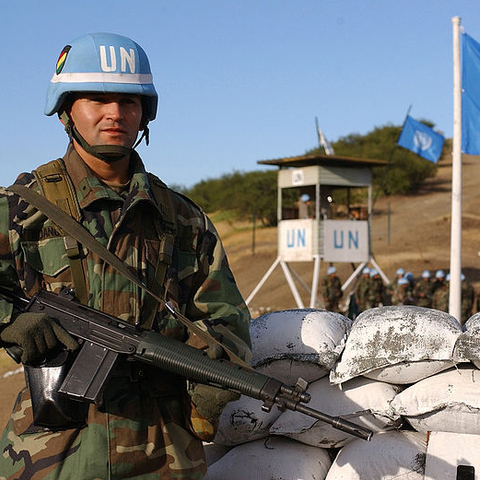 A Bolivian soldier standing guard at the entry point to a UN peacekeeping training facility.
