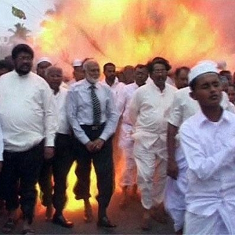 Screen shot of video footage of a suicide bomber detonating a bomb during a ceremony.