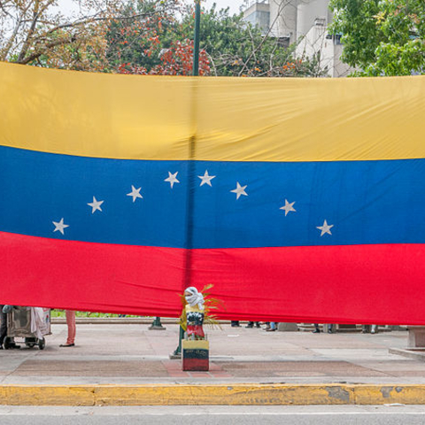 The Venezuelan flag unfurled at a peaceful protest against Nicolás Maduro in 2014.