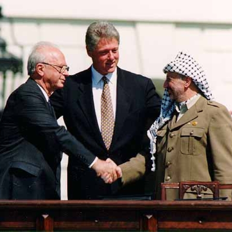Yitzhak Rabin, Bill Clinton, and Yasser Arafat.