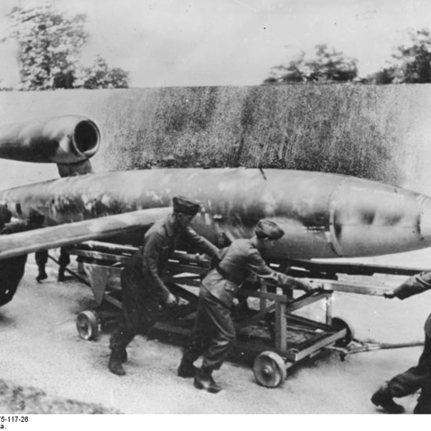 Nazi soldiers roll out a flying bomb.