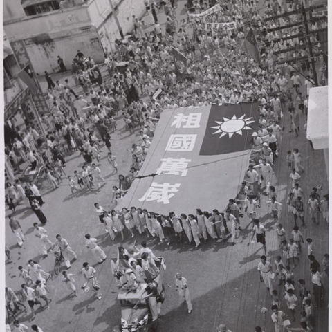 Singapore's Chinese community carries the flag of the Republic of China.