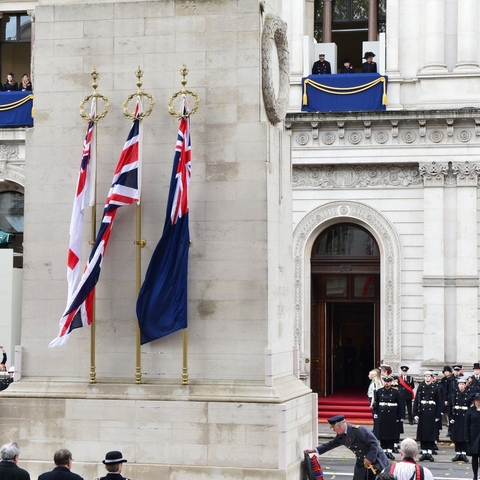 Charles, Prince of Wales, laying a wreath at a Remembrance Day service.