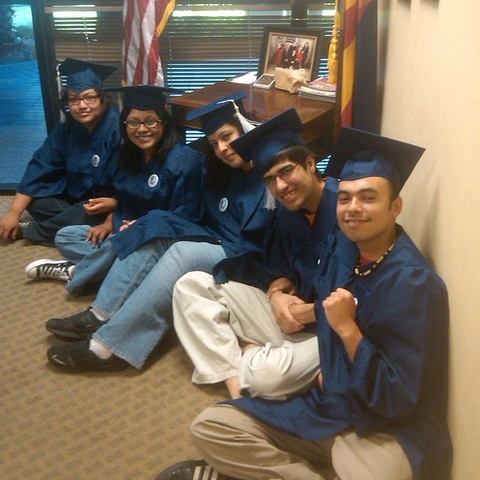 Students sit in on Senator John McCain's office during a protest.