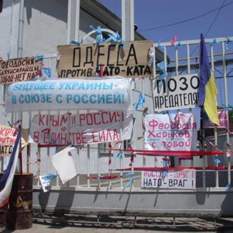 Signs protesting NATO in Feodosiya, Ukraine.