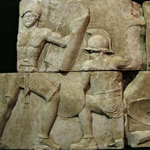 The fragmentary relief of a Roman gladiatorial scene.