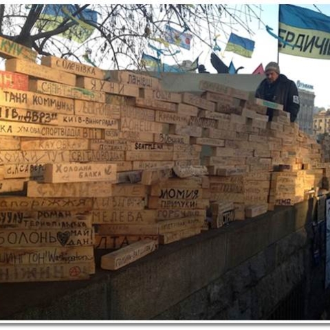 Hundreds of city names on woodblocks, created in support of EuroMaidan
