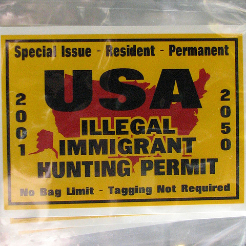 An 'Illegal Immigrant Hunting Permit' bumper sticker.
