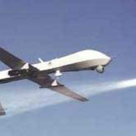 An armed Predator drone launches a Hellfire missile.