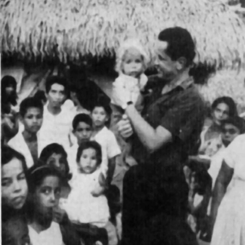 Father Camilo Torres among peasants.