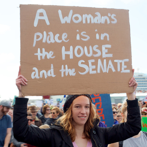 A protestor describing women’s place as being in government.