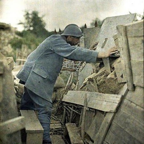 A French soldier peers out of his observation post.