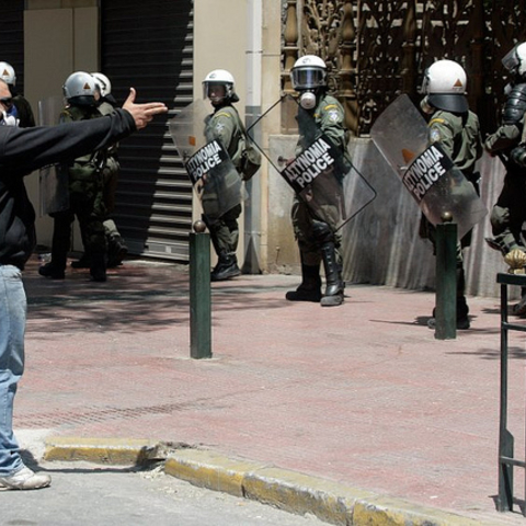 A protester facing the police during May Day protests.