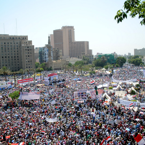 Hundreds of thousands of people protesting in Tahrir Square.