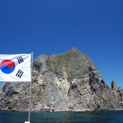 The Korean flag flies over Liancourt Rock's East Islet.