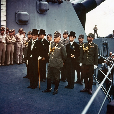 Representatives of the Empire of Japan stand aboard the USS Missouri.