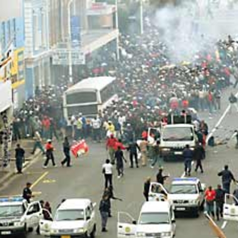 Security guards in South Africa clashing with police.