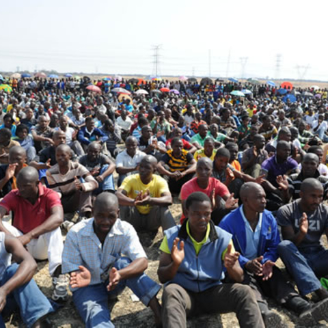 Miners listening to President Jacob Zuma.