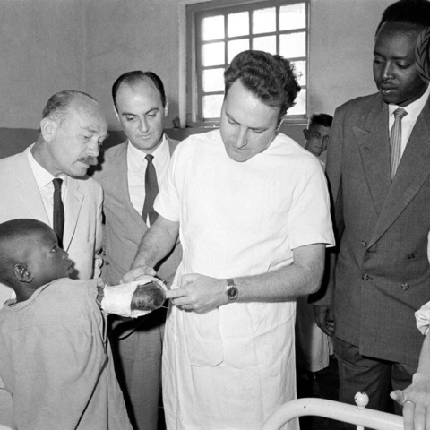 Pictured here are Dr. Paul Stercke of Belgium, the Minister of Health, and two members of a WHO visiting team.