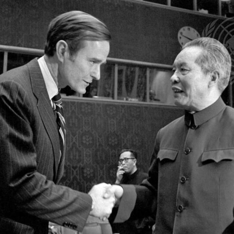 Huang Hua, Permanent Representative of China to the UN, is greeted by George H. Bush, Permanent Representative of the United States.
