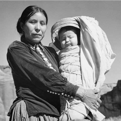 A picture of a Navajo woman and infant at the Canyon de Chelle in Arizona.