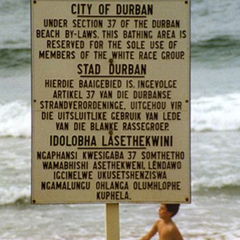 A sign in English, Afrikaans, and Zulu in the 1980s.
