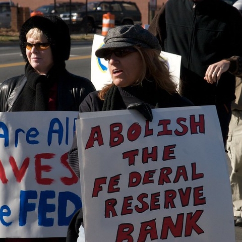 Protestors in Charlotte, North Carolina demand an end to the Federal Reserve System.