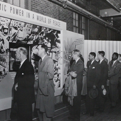 Americans view an exhibit on atomic power.