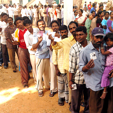 Men and women in Karnataka, India, voting in 2009 General Election.