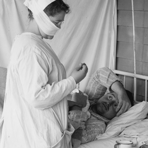 Nurse with a mask and patient in the Walter Reed Hospital.